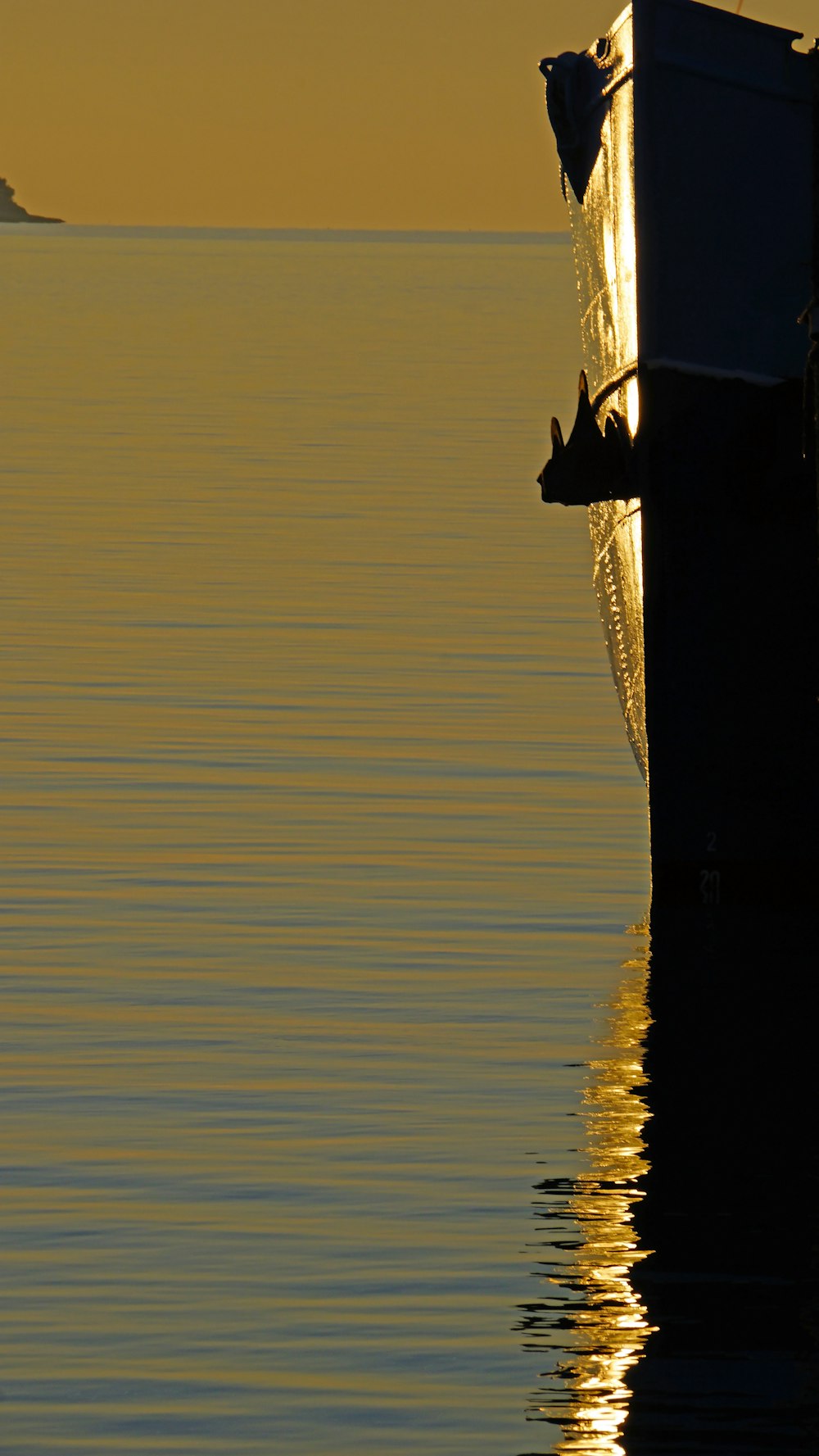 a boat in the water with a boat in the distance