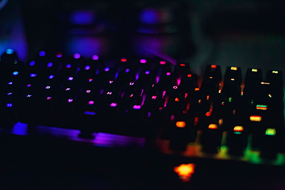 a close up of a keyboard in a dark room