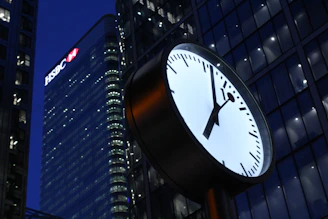 Digital clock overlay on a city skyline symbolizing fast financial transactions.