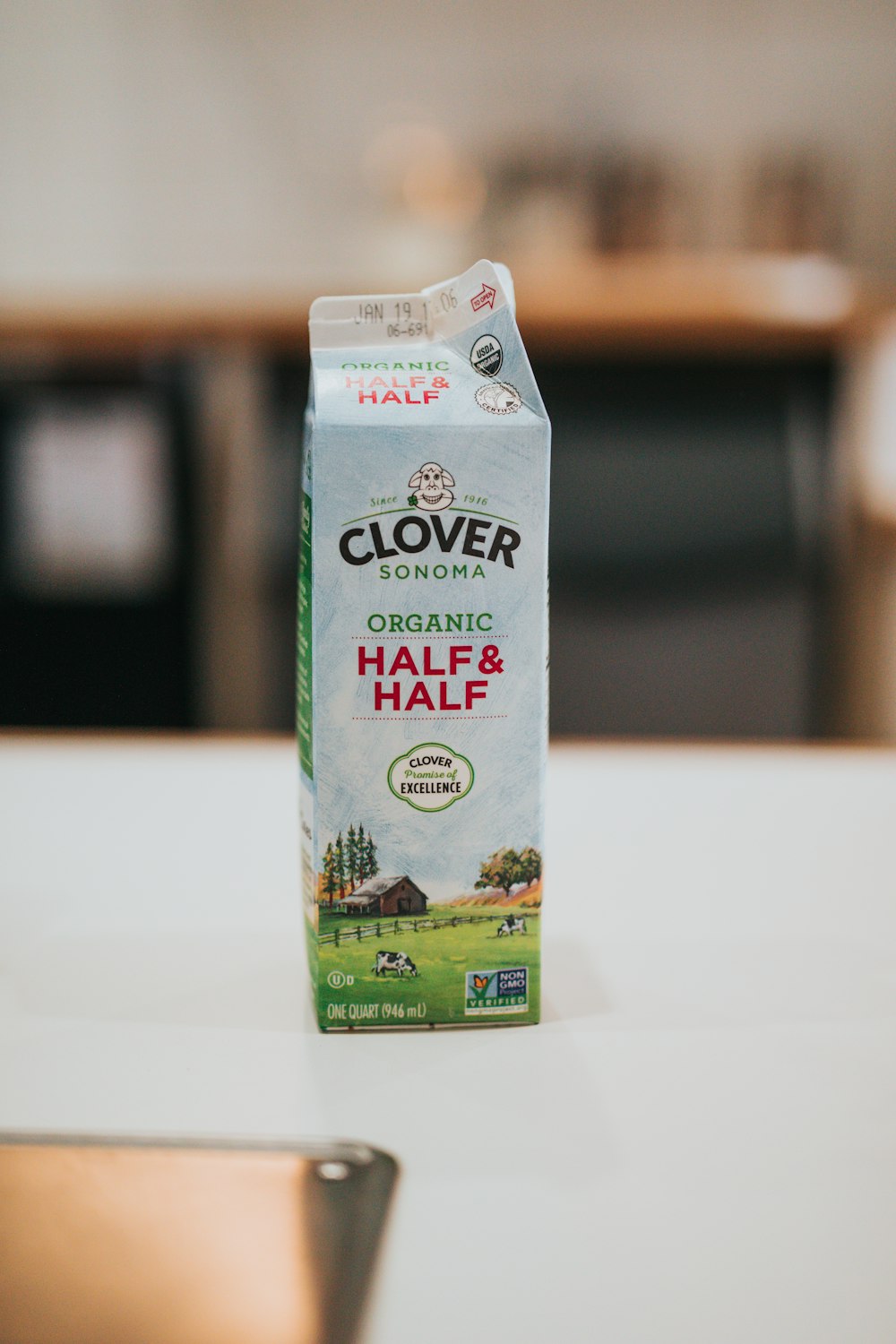 a carton of milk sitting on top of a table