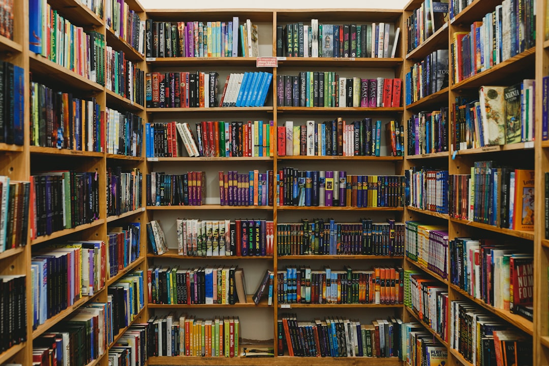 a book shelf filled with lots of books,