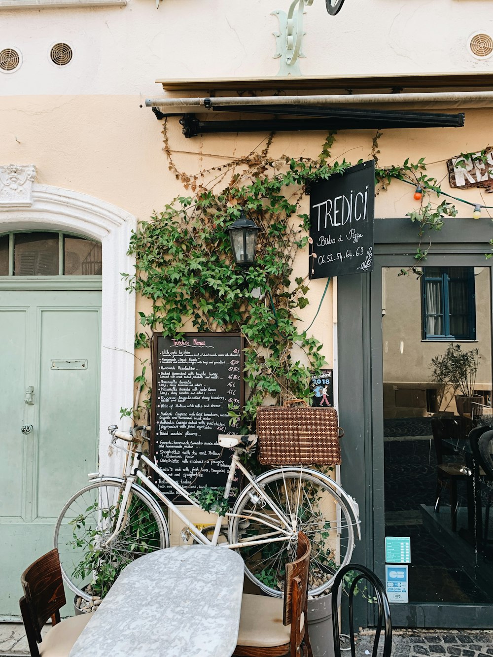 a bicycle is parked outside of a restaurant