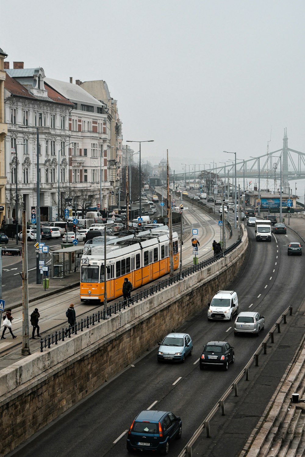 yellow and white bus on road during daytime