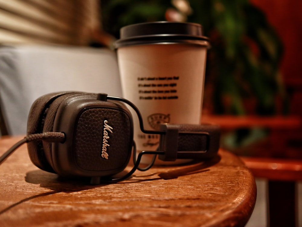 black and white coffee cup on brown wooden table