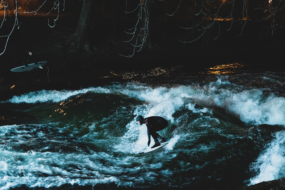 person surfing on water waves during daytime