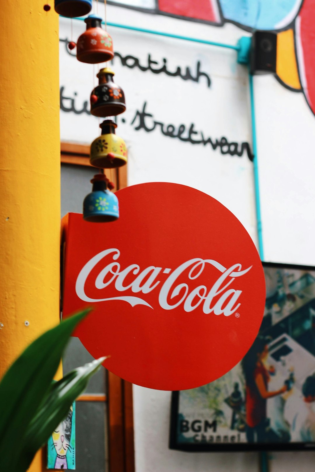 red and white coca cola signage