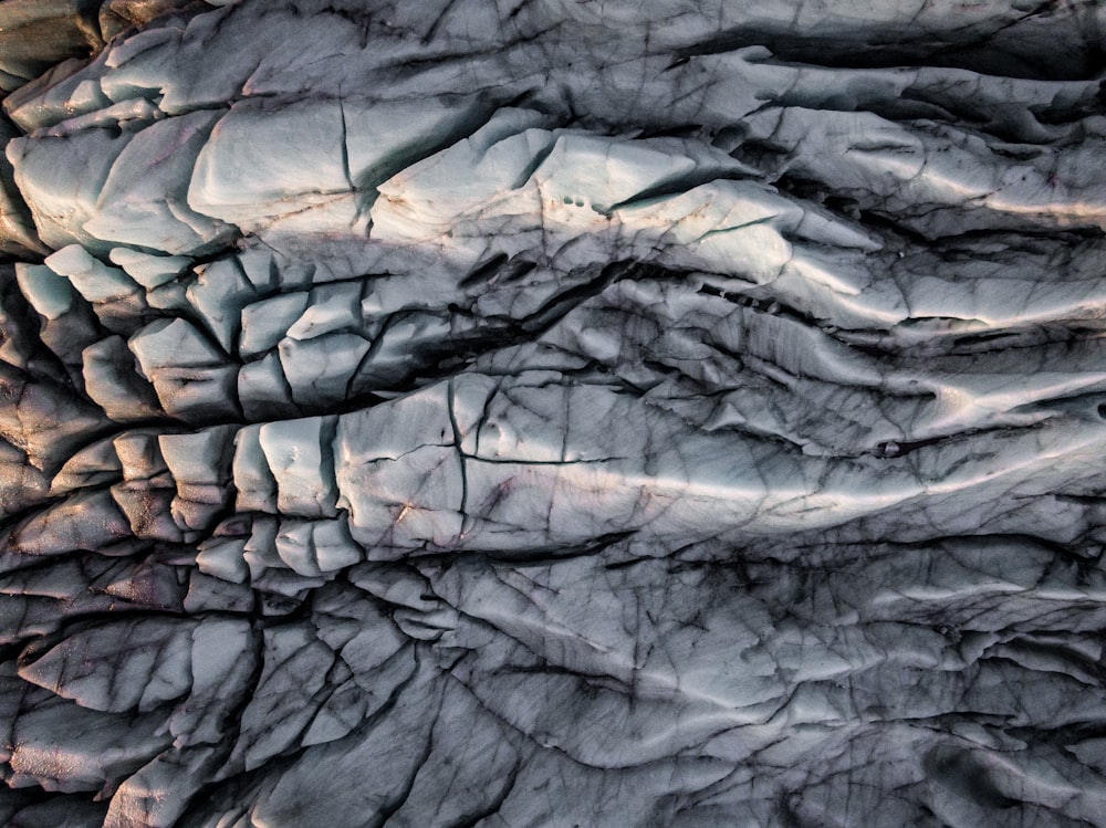 a close up of a rock formation with a sky in the background