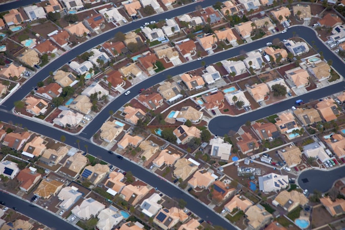 Aerial view of a Las Vegas neighborhood full of homes with pools, showing the tight valley housing market