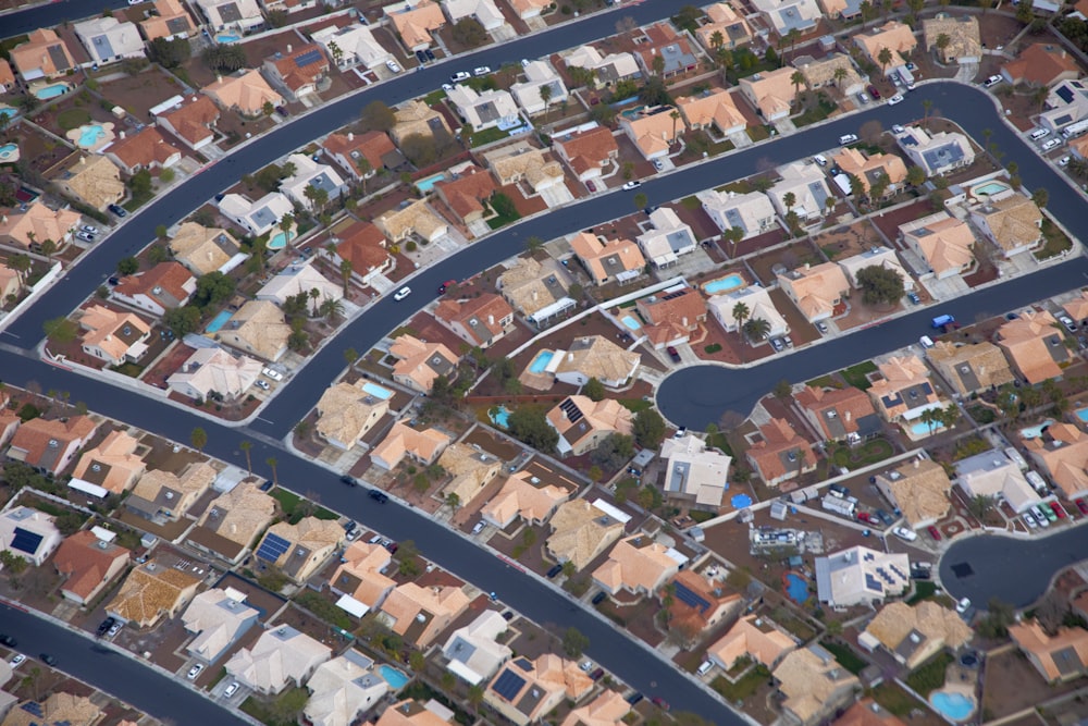 an aerial view of a city with lots of houses