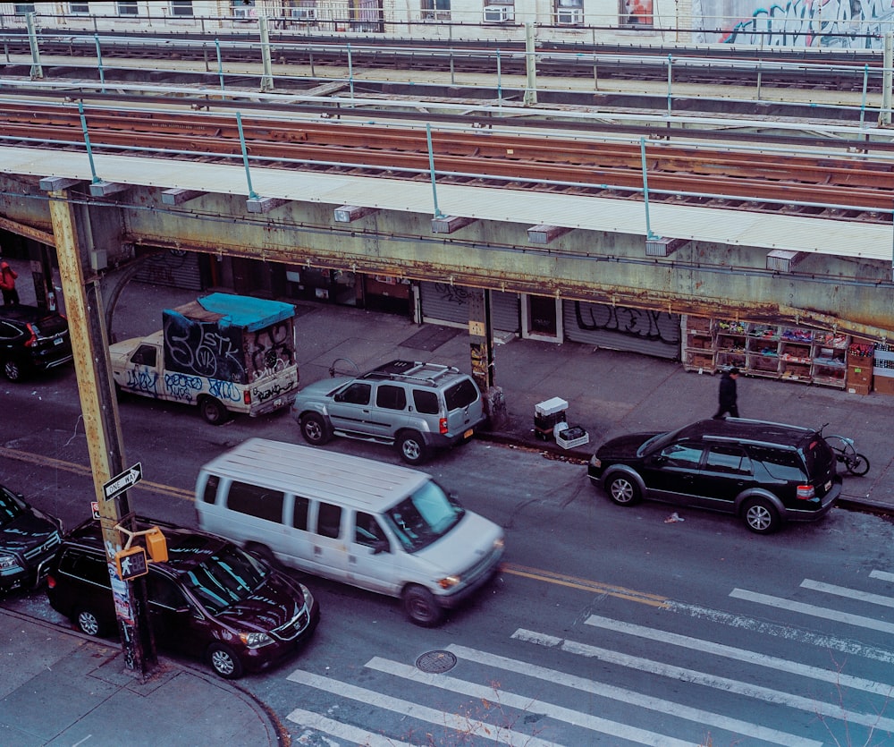 a group of cars that are sitting in the street