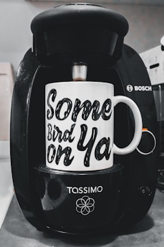 Bosch coffee machine technician testing functionality after service.