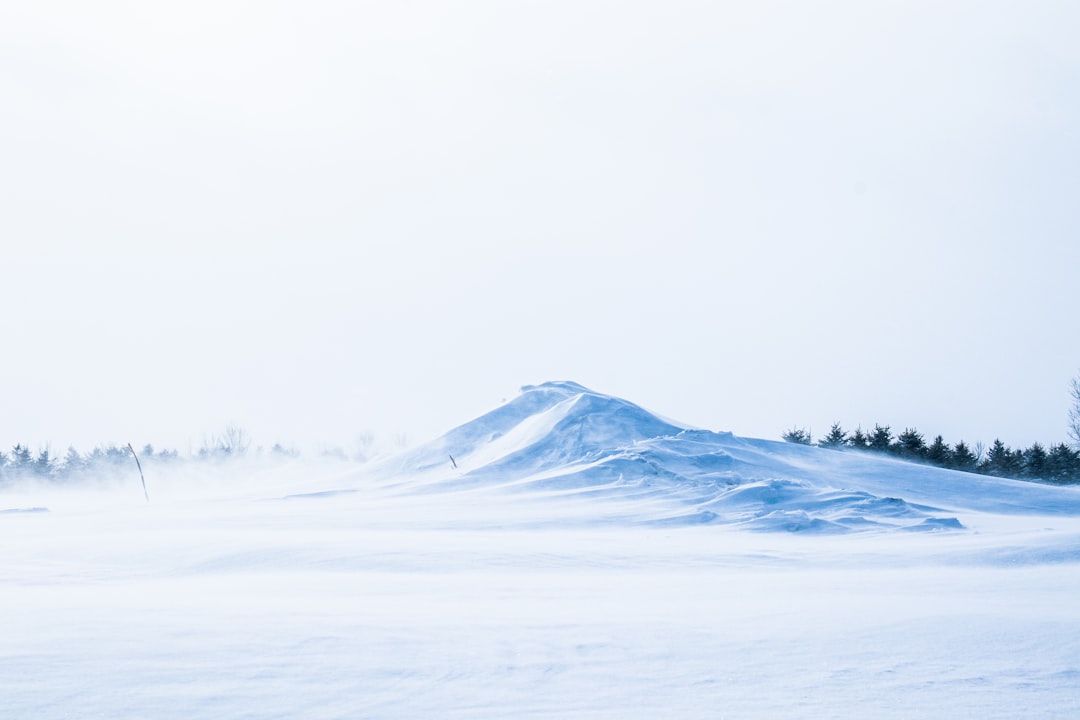 snow covered mountain during daytime