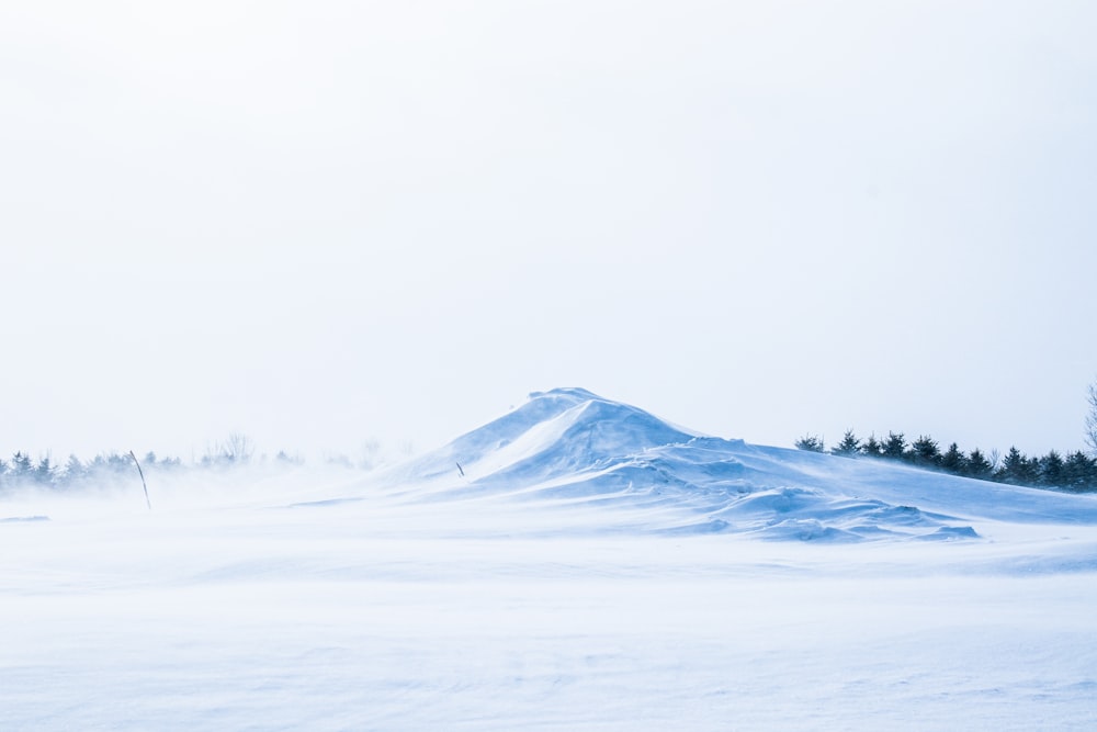 snow covered mountain during daytime