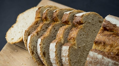 a close up of sliced bread on a cutting board