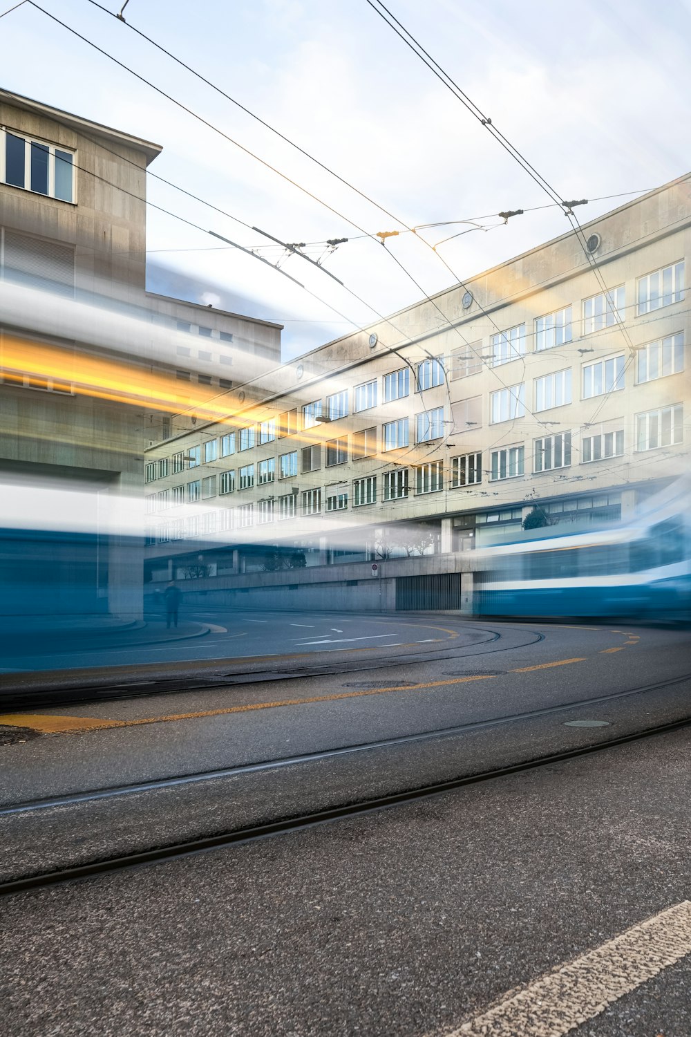 a blurry photo of a train passing by a building