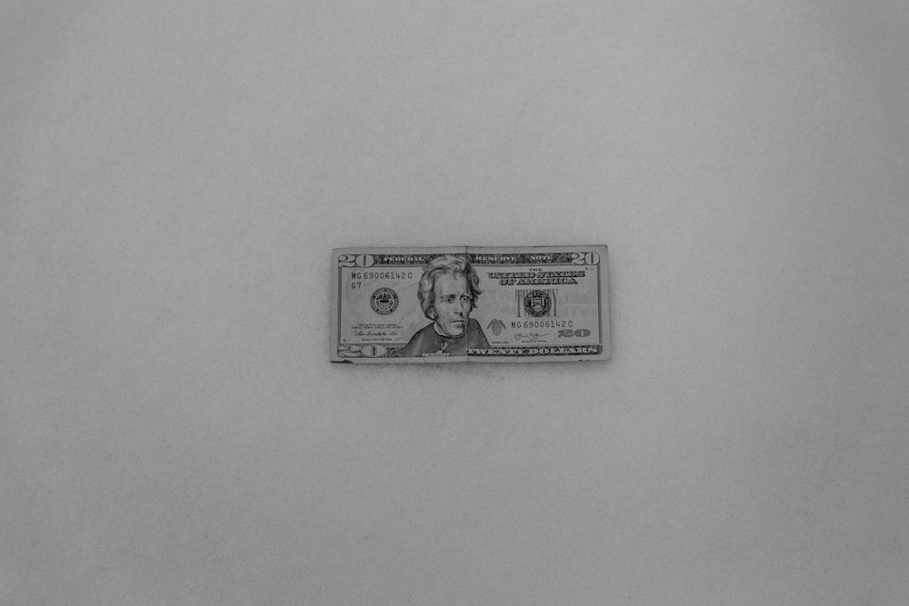 a black and white photo of a one dollar bill