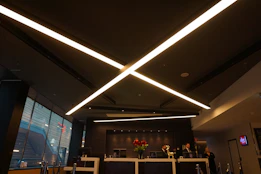 A welcoming office reception area with modern decor and a friendly consultant ready to assist clients.