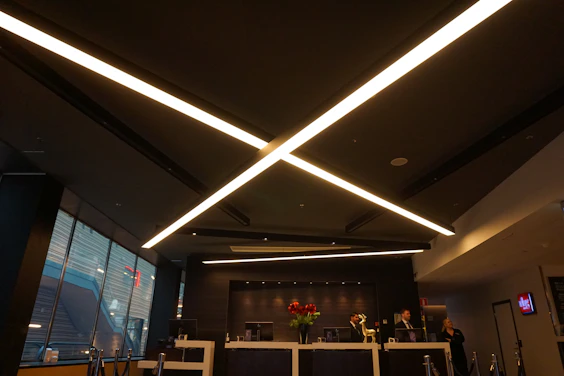 A warm office reception desk with a friendly team ready to assist international clients.