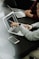 two people sitting at a table with laptops