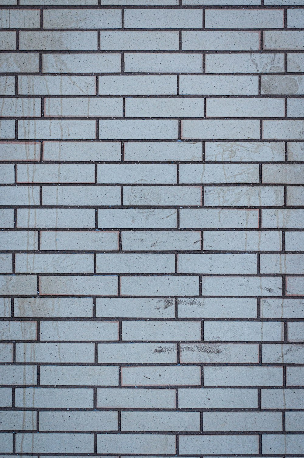 a close up of a white brick wall