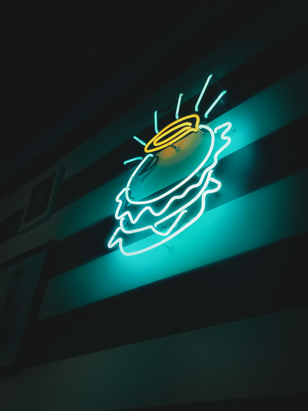 a neon sign with a hot dog on it