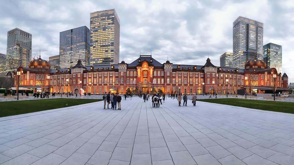 a group of people standing in front of a building