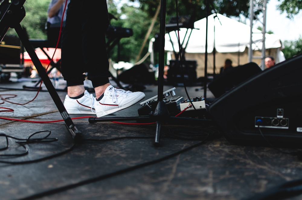 a person standing on a stage with a microphone