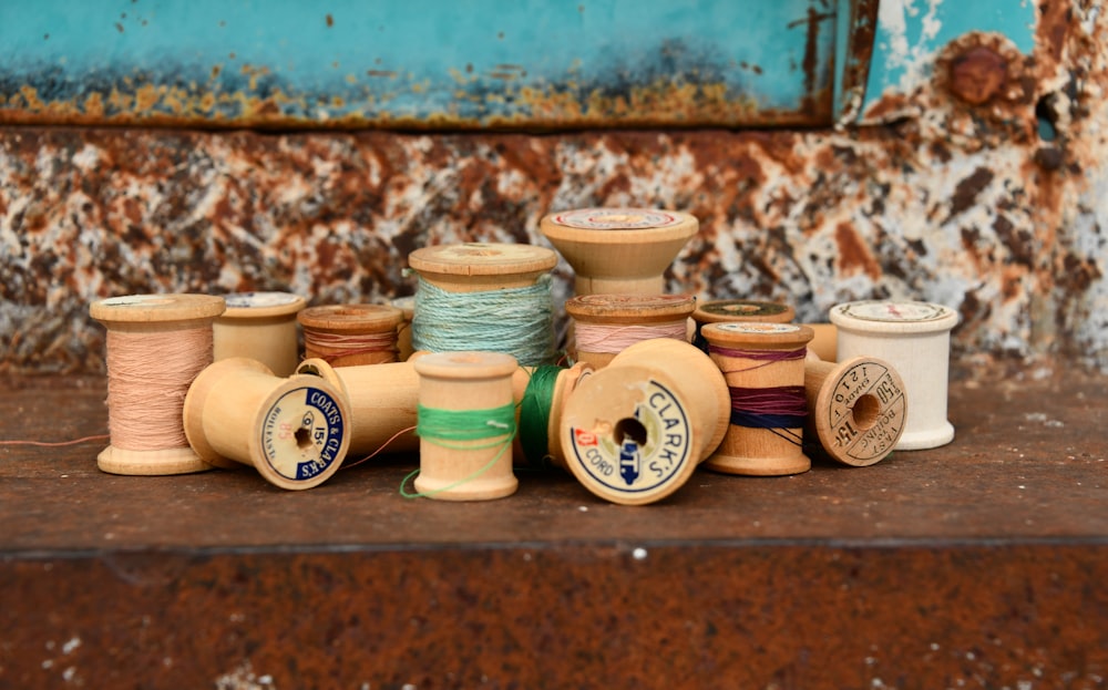 a group of spools of thread and spools of thread on a