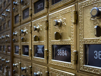 a bunch of mail boxes with numbers on them