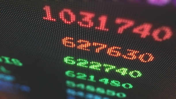 Close-up of a sleek modern dashboard displaying stock market data and AI analysis.