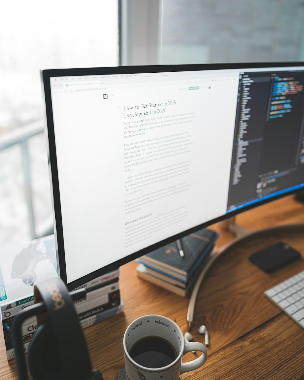 a computer monitor sitting on top of a wooden desk