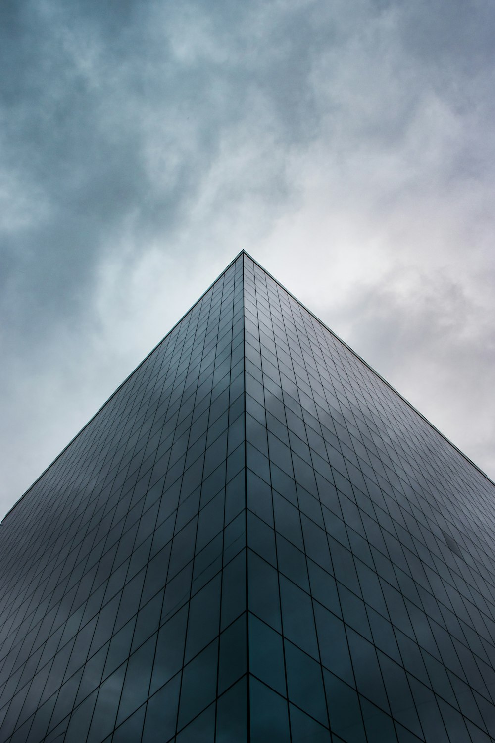 a very tall building with a sky in the background