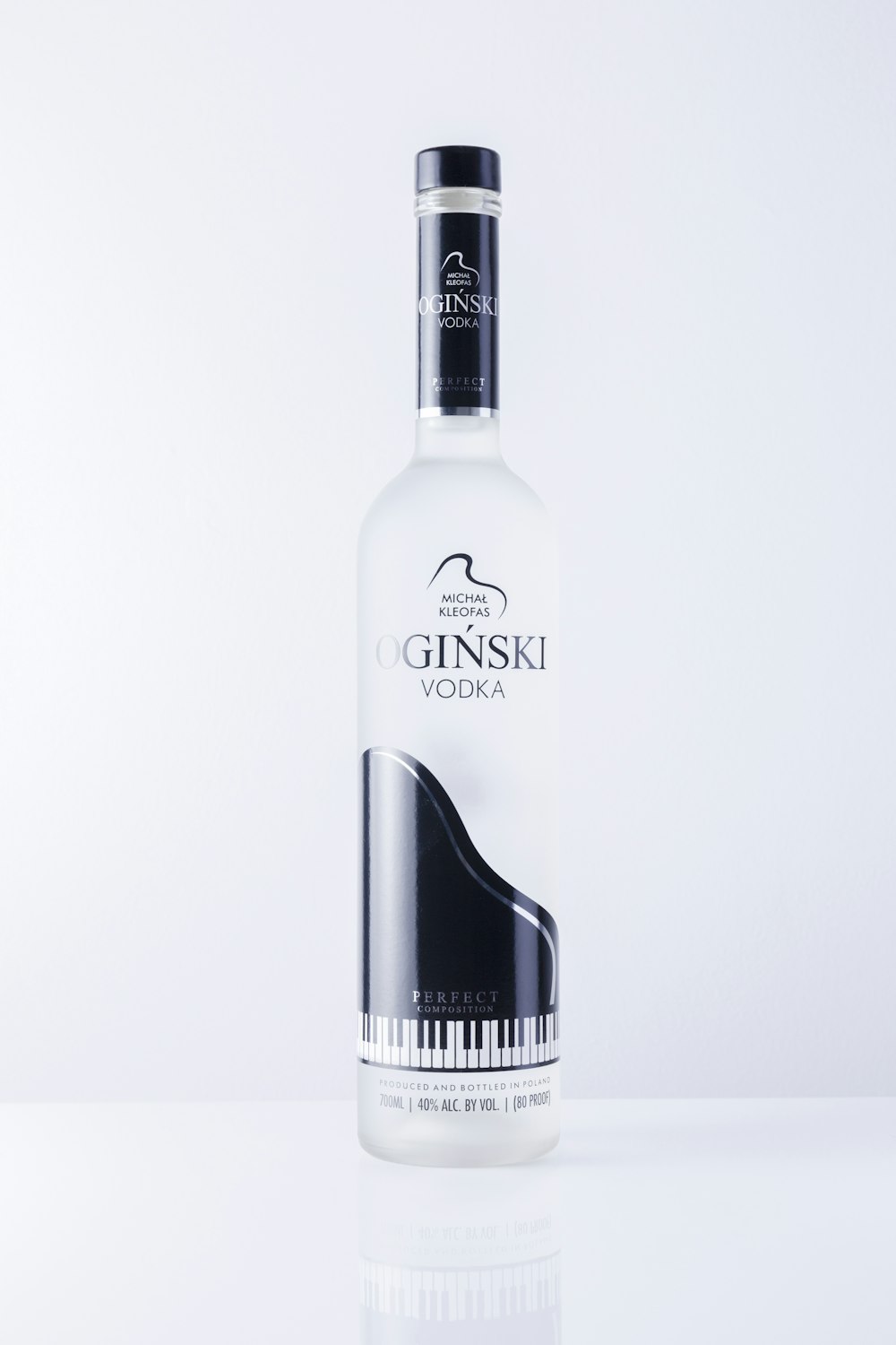 a bottle of vodka with a piano on it