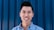 man in blue button up shirt smiling