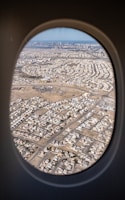 An aerial view of a bustling city from a plane.