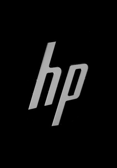 The image displays a stylized lowercase 'hp' logo in white color against a black background.