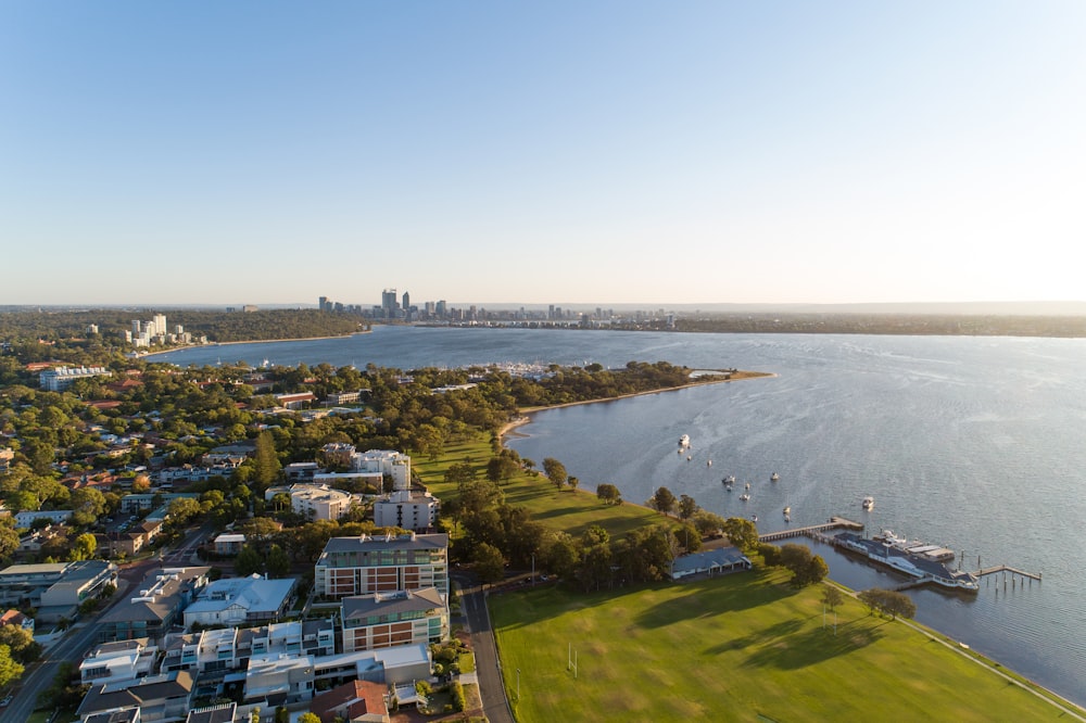 an aerial view of a city and a body of water