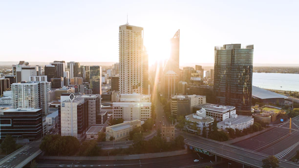 A downtown Denver cityscape at sunrise, symbolizing financial growth and opportunity.