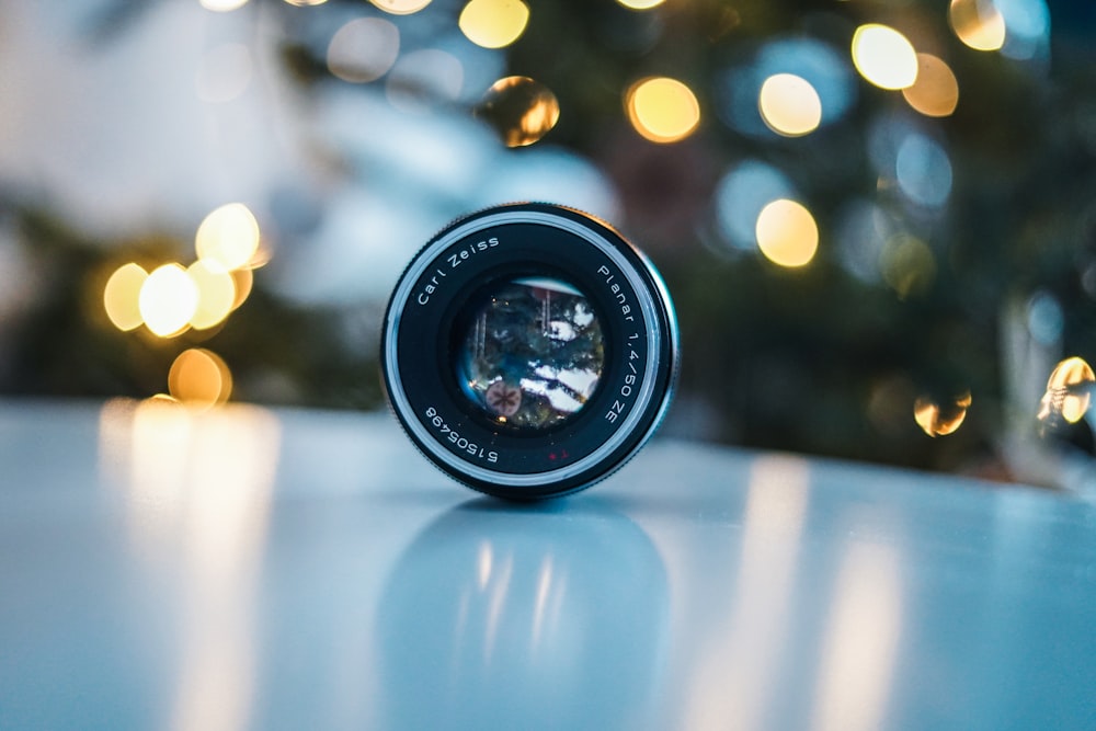 black camera lens on blue table