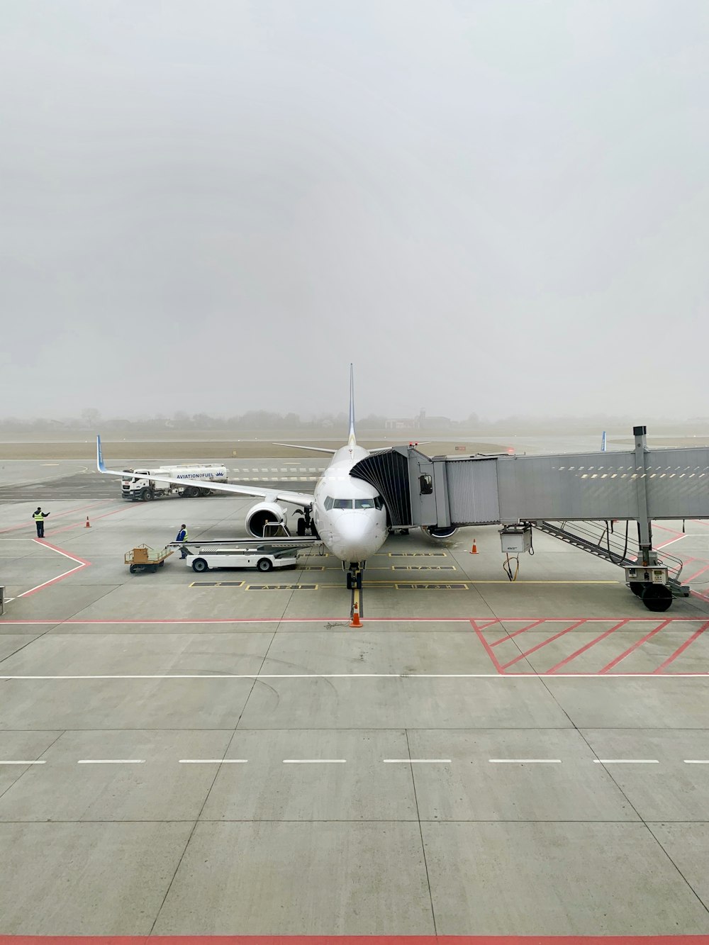 white airplane on airport during daytime