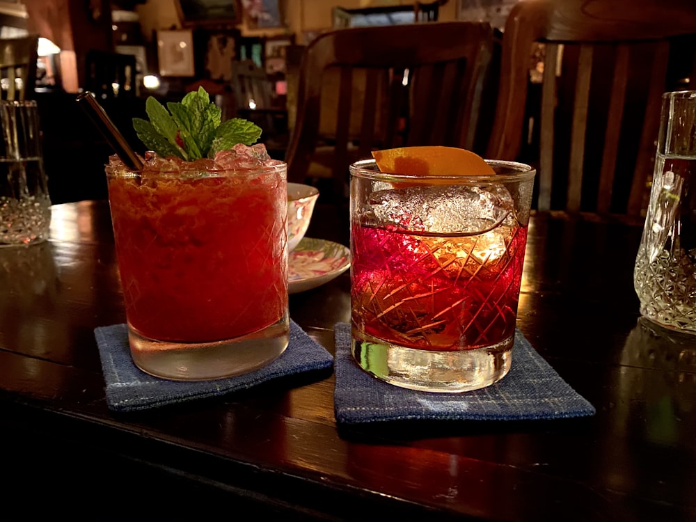 clear drinking glass with red liquid inside