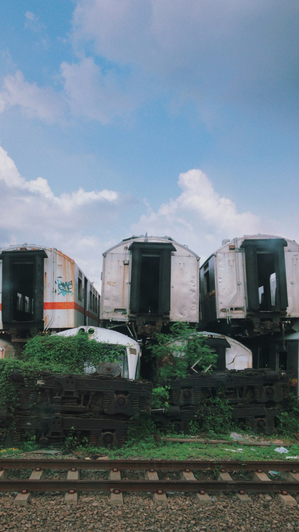 a group of train cars sitting on top of train tracks