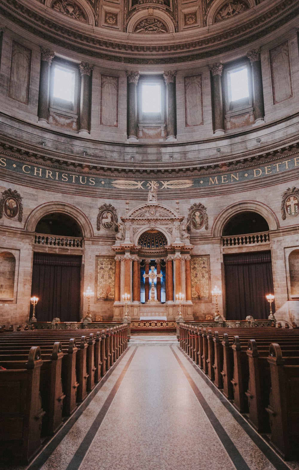 brown wooden chairs inside church