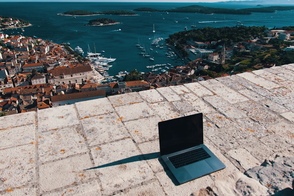 aerial view of city buildings near body of water during daytime