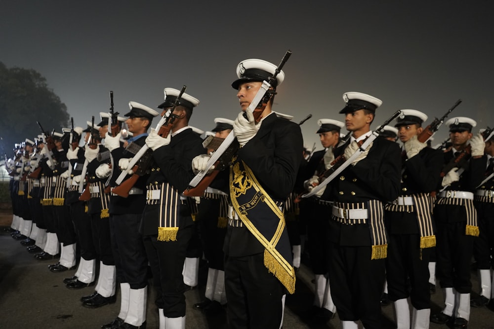 group of men in black and white uniform playing musical instruments