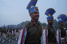 a group of men in uniform marching down a street