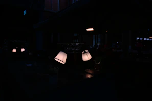 Lifestyle image showing the product in a dimly lit modern room with ambient glow accents.