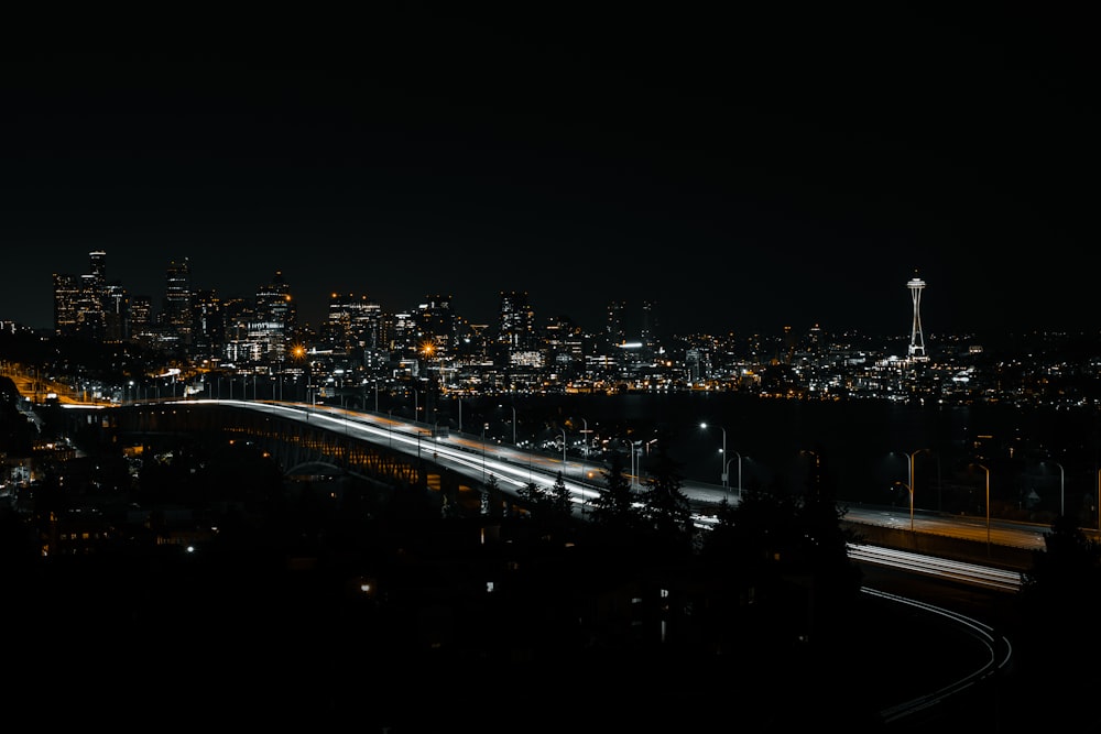 a view of a city at night from a hill