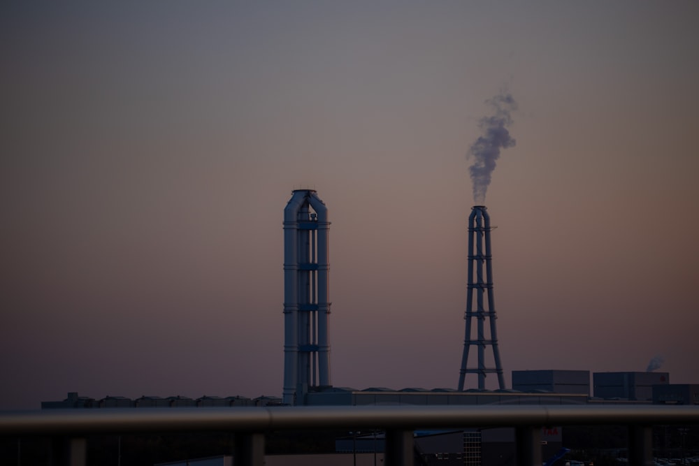 a factory with smoke coming out of it's stacks