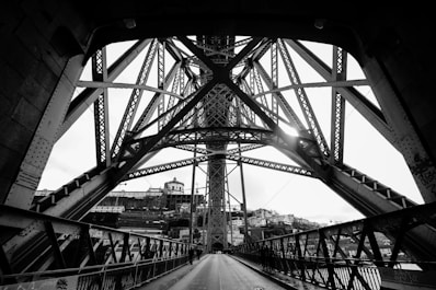 a black and white photo of a bridge